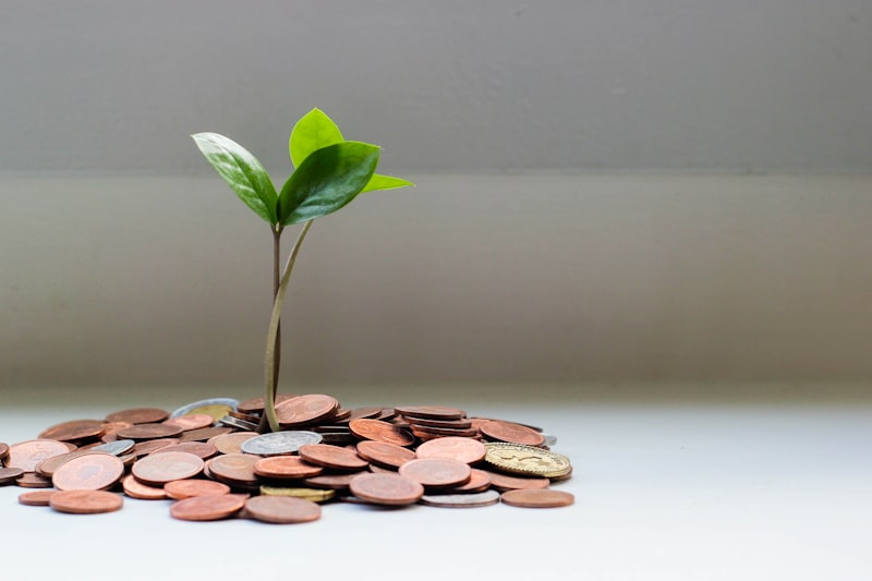Piggy bank and coins representing saving for a mortgage deposit